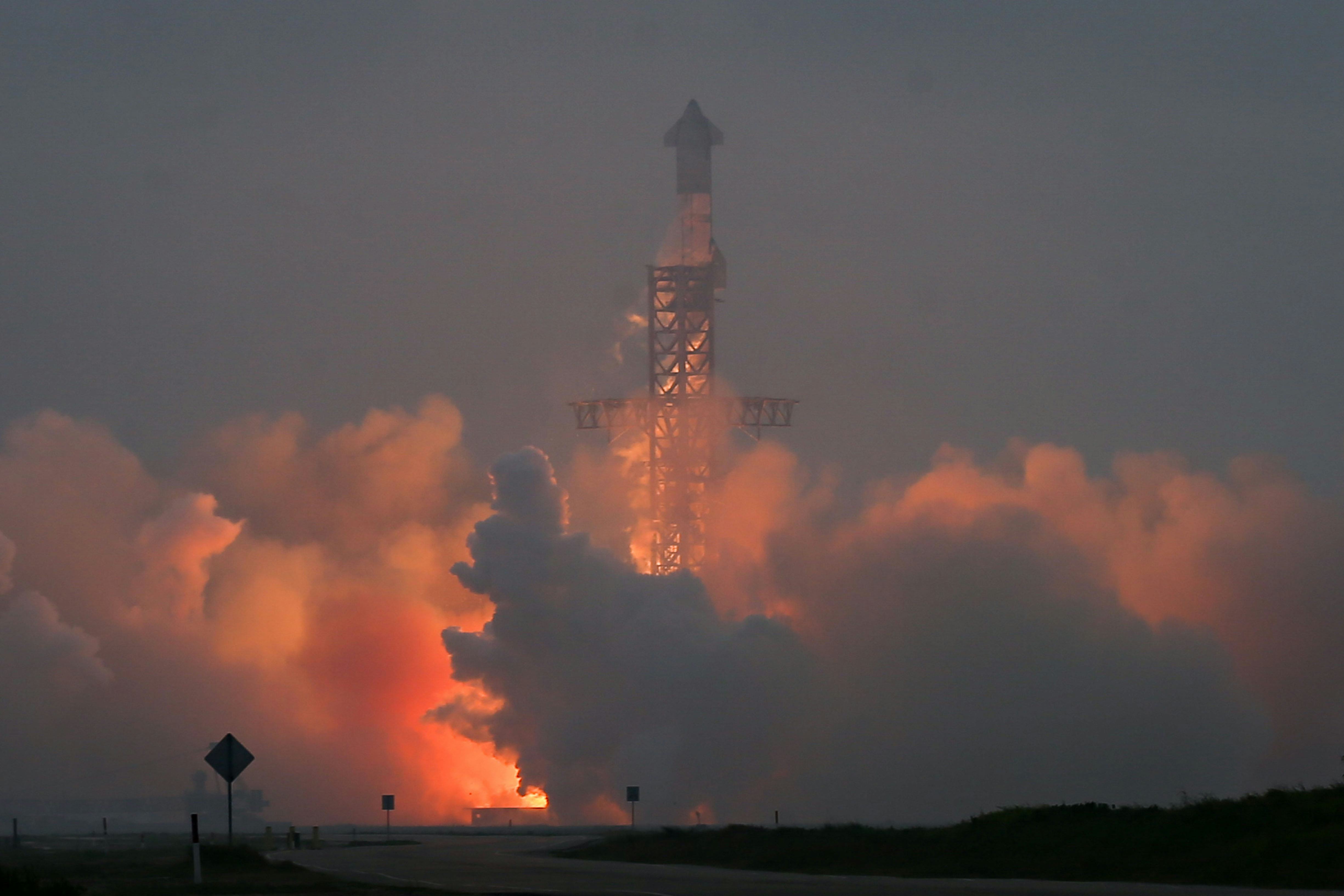 BOCA CHICA, TEXAS - MARCH 14: The Starship spacecraft, atop the Super Heavy rocket, lifts off on a h...