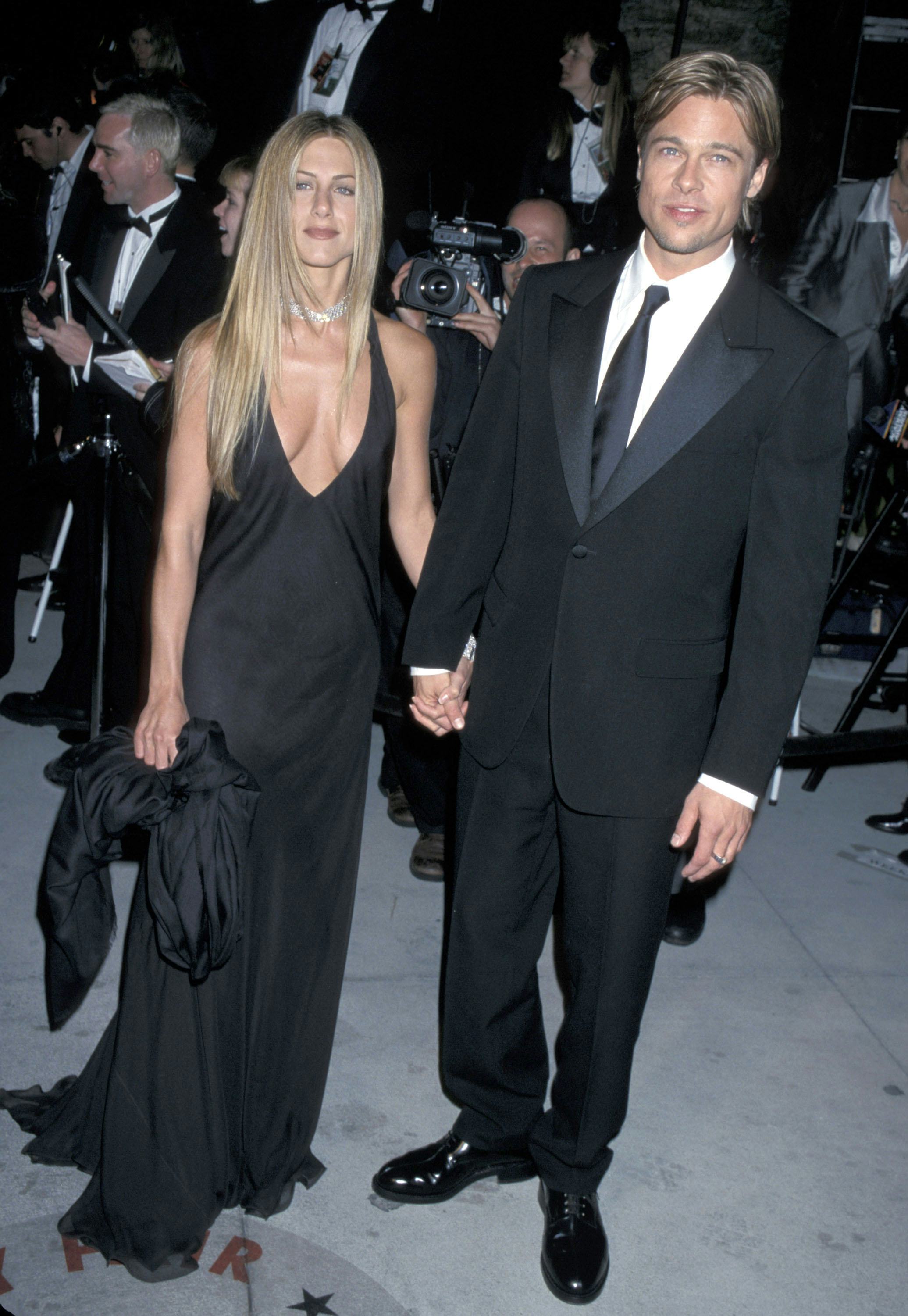 Jennifer Aniston wears a black halter dress with Brad Pitt at the Vanity Fair Party held at Morton&rsquo;s&hellip;