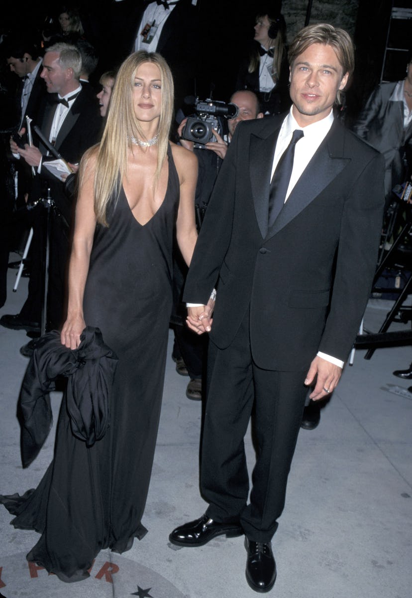 Jennifer Aniston wears a black halter dress with Brad Pitt at the Vanity Fair Party held at Morton's...