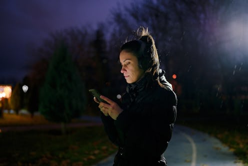 Part of a series of a woman doing exercises in a public park during winter.