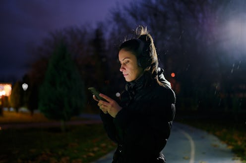 Part of a series of a woman doing exercises in a public park during winter.