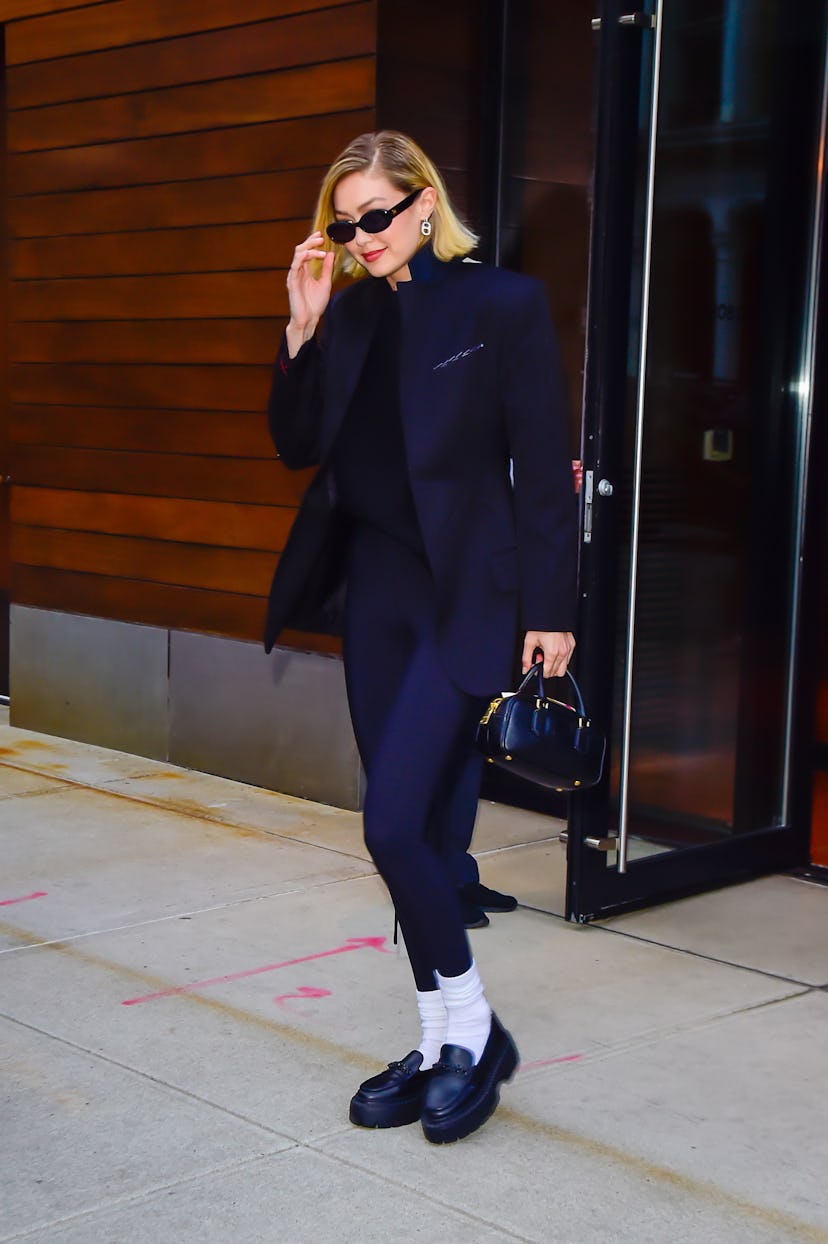Gigi Hadid wore leggings as pants with a blazer on March 14, 2024 in New York City. 