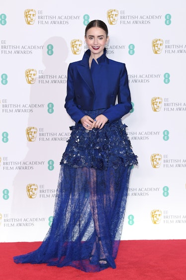 Lily Collins poses in the press room during the EE British Academy Film Awards 