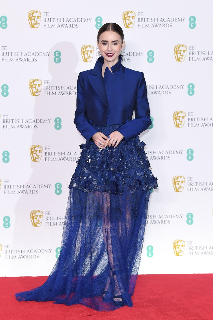 Lily Collins poses in the press room during the EE British Academy Film Awards 