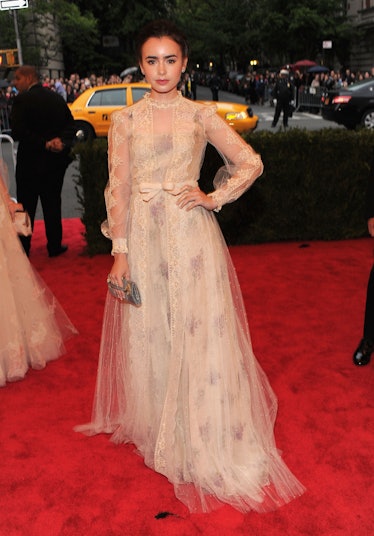 Lily Collins attends the "Schiaparelli And Prada: Impossible Conversations" Costume Institute Gala 