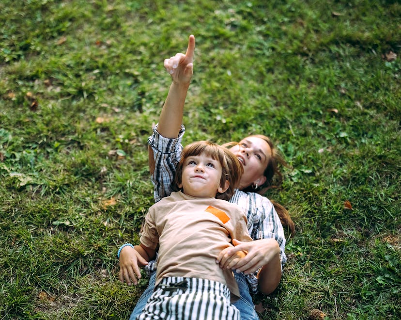 Mother and son play together in the park