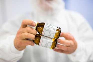 An employee holds bottles of Epidiolex, a cannabinoid-based medicine, at the GW Pharmaceuticals Plc ...