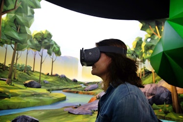 A woman tries on Google's virtual reality (VR) device 