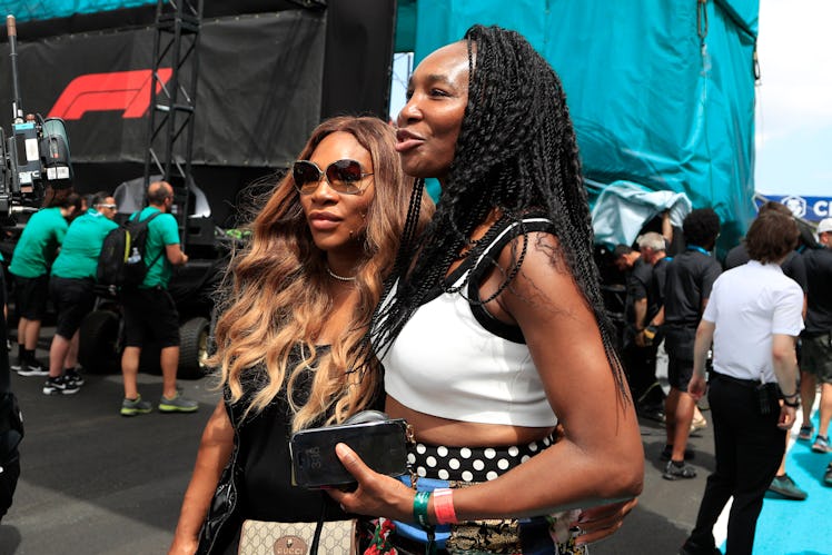 MIAMI GARDENS, FL - MAY 07:  Venus and Serena Williams walk on the grid prior to the running of the ...