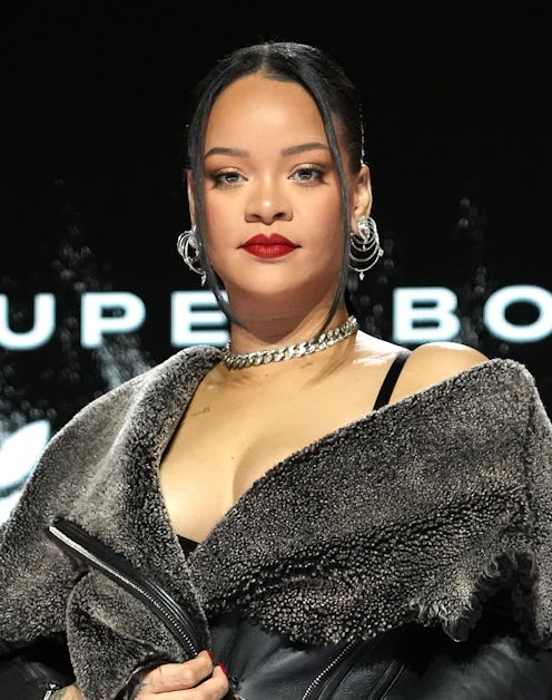 Rihanna poses on stage during the Apple Music Super Bowl LVII Halftime Show.