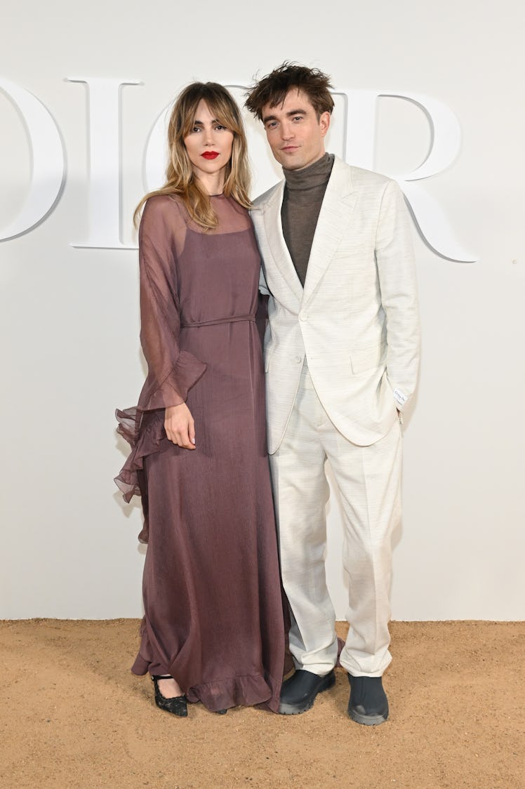 Suki Waterhouse and Robert Pattinson attend the Dior Fall 2023 Menswear Show on December 03, 2022 in...