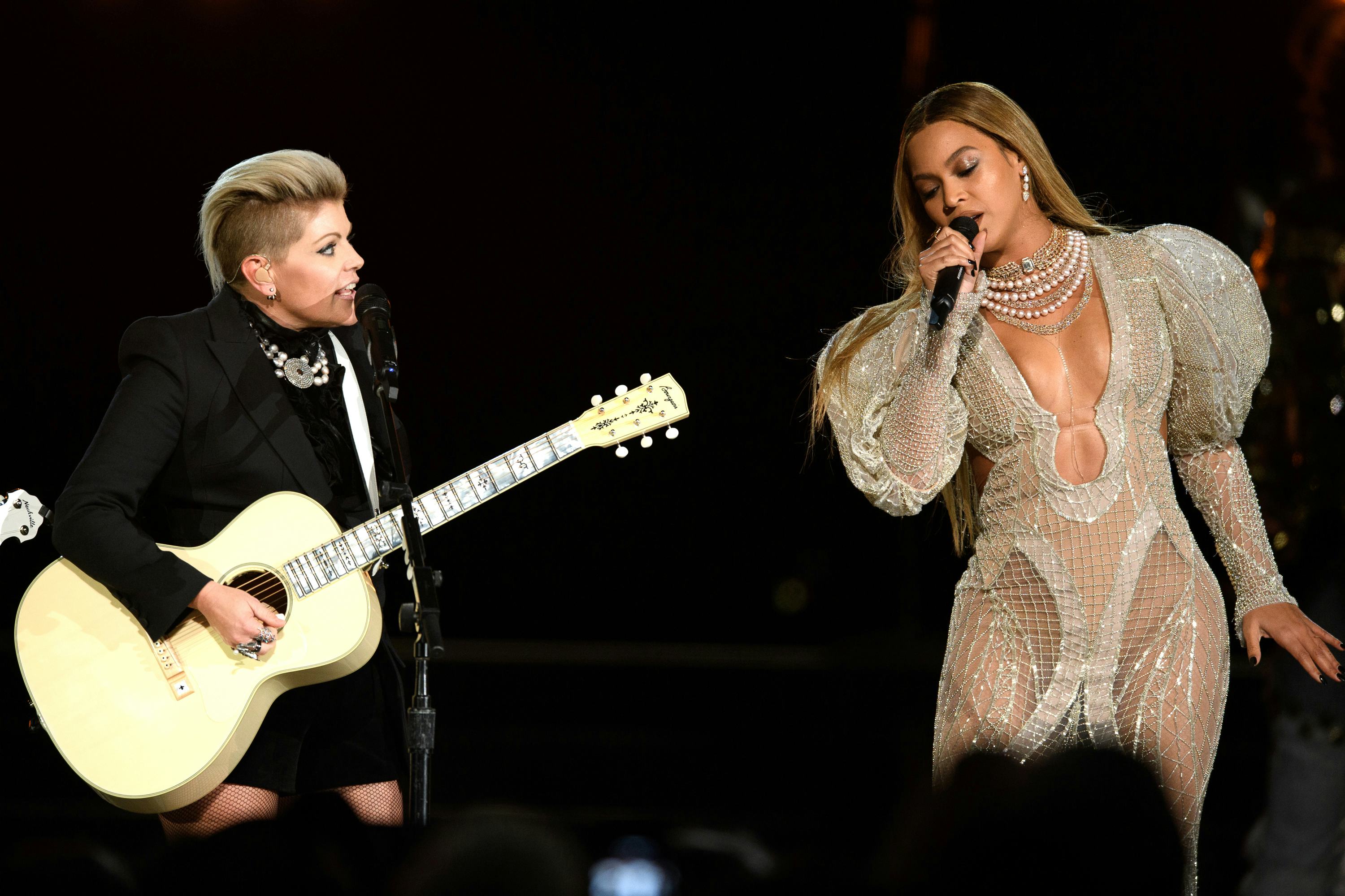 Natalie Maines and Beyoncé performing at the 2016 Country Music Awards.