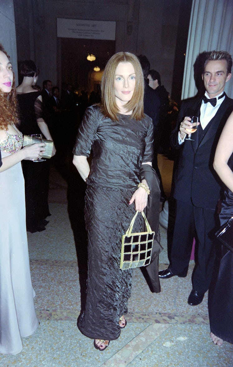 Julianne Moore (C) attends the Costume Institute Gala at the Metropolitan Museum of Art in New York ...