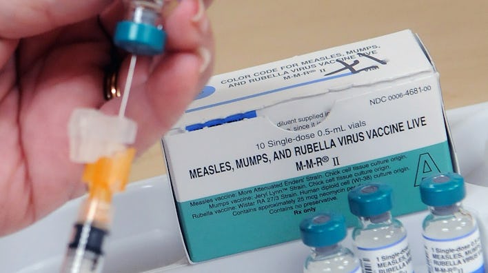 A nurse demonstrates how a measles vaccine is administered at the Orange County Health Department on...