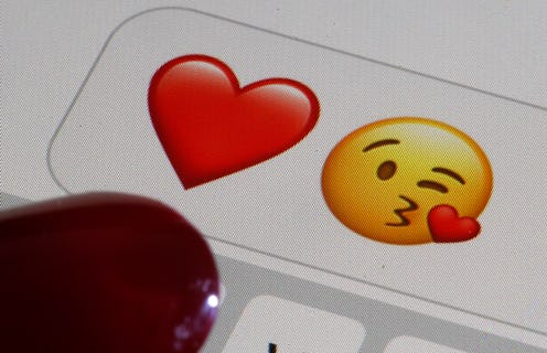 PARIS, FRANCE - FEBRUARY 14: In this photo illustration, emoji or emoticon representing a heart and ...
