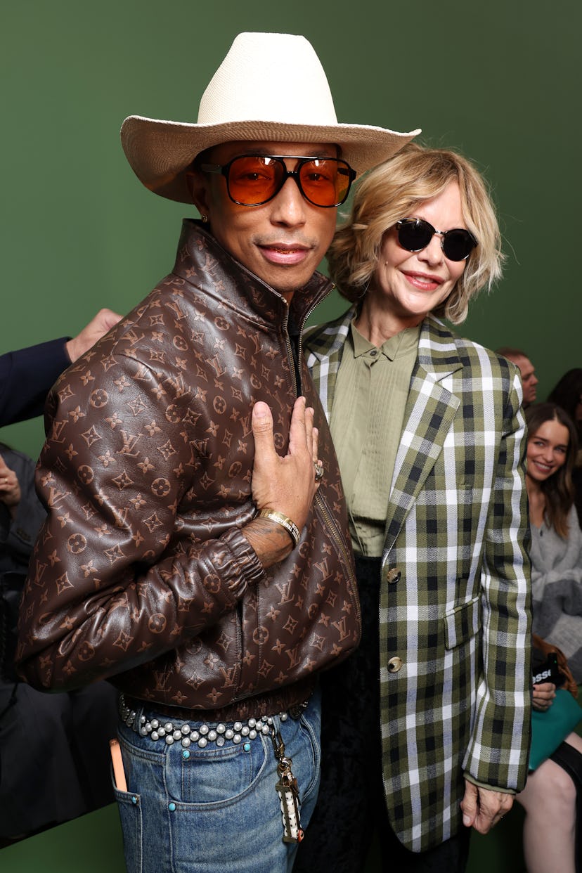 PARIS, FRANCE - MARCH 01: Pharrell Williams and Meg Ryan attend the Loewe Womenswear Fall/Winter 202...