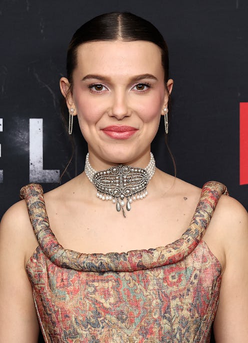 Millie Bobby Brown attends the "Damsel" Photo Call in a brocade bustier top