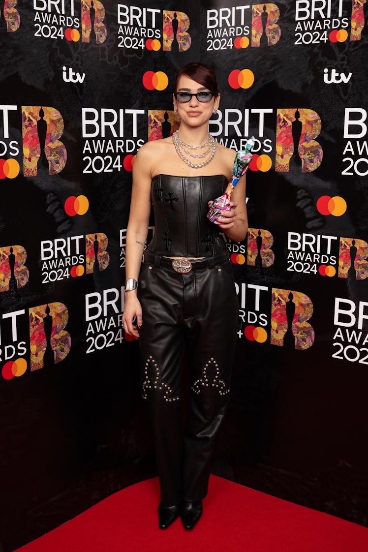 Dua Lipa poses with the Pop Act Award during the BRIT Awards 2024 at The O2 Arena on March 02, 2024 ...