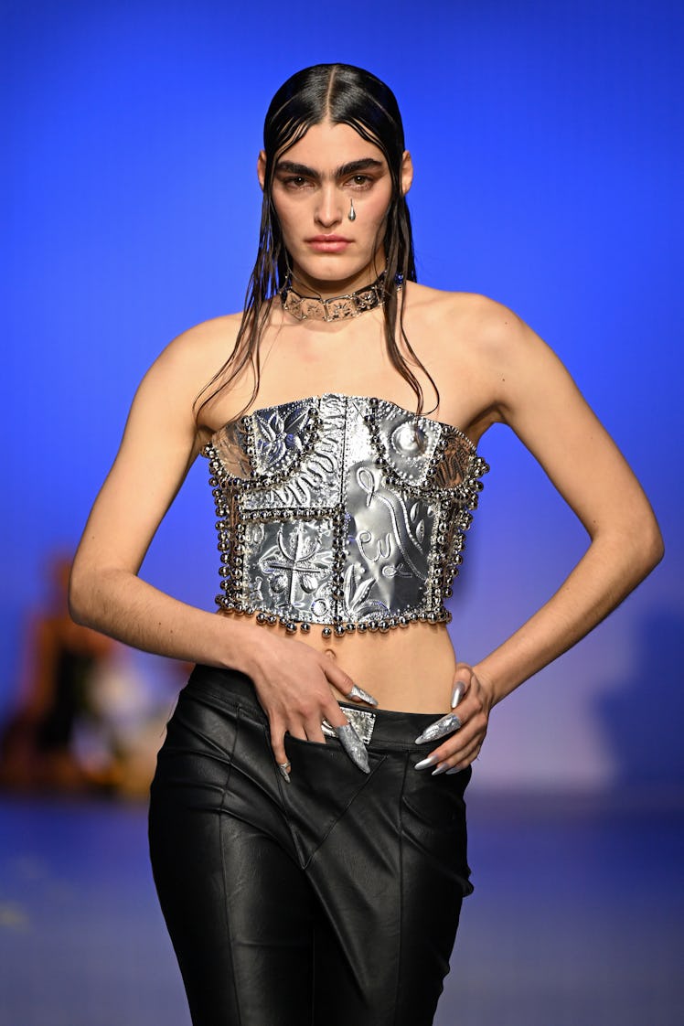 LONDON, ENGLAND - FEBRUARY 19: A model walks the runway at the DI PETSA show during London Fashion W...