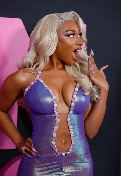 Megan Thee Stallion wears a bellybutton ring.