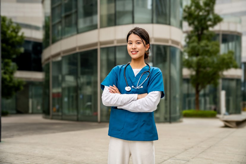 Portrait of a young, happy and helping nursing worker