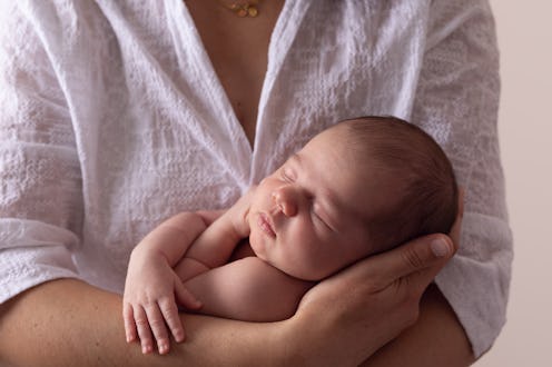Portrait of mother and newborn daughter- Mother holding newborn baby girl - Buenos Aires. Argentina....