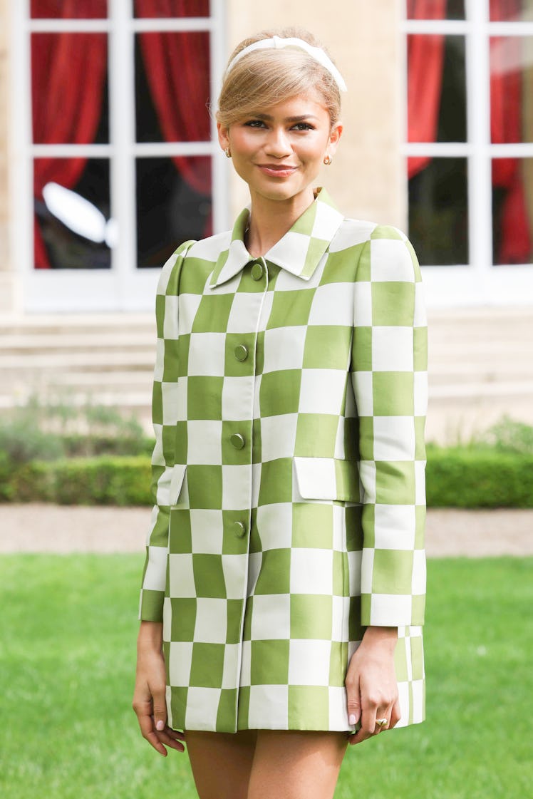 Zendaya continued wearing tennis ball-green with this 1960s-inspired dress in France. 