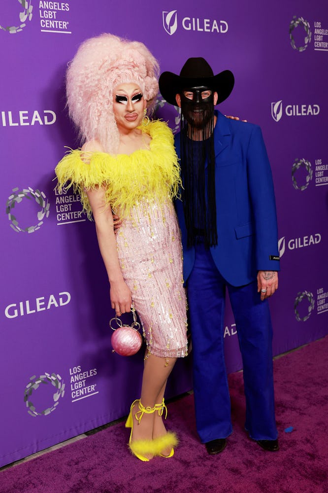 US drag queen Brian Michael Firkus aka Trixie Mattel (L) and Musician Orville Peck arrive for the Lo...