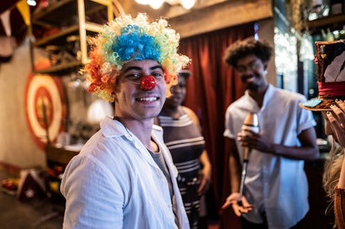 Portrait of a young man with friends at circus
