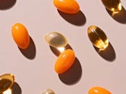 Various of Soft Gel Capsule Pills on Beige Background High Angle View.