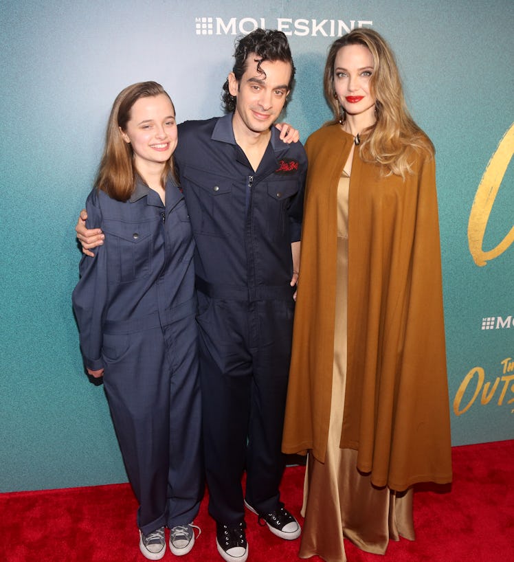 Vivienne Jolie-Pitt, Justin Levine and Angelina Jolie attend the opening night of "The Outsiders" at...