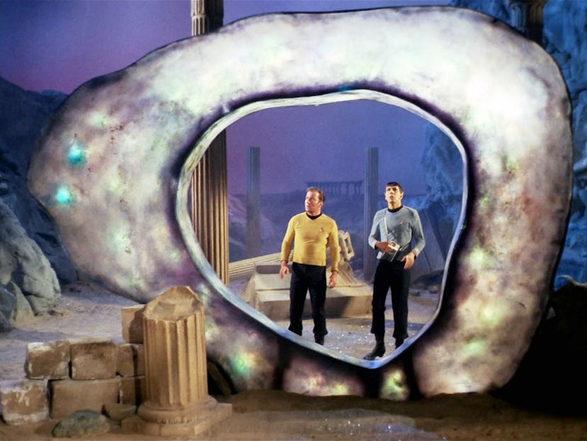 William Shatner as Capt. James T. Kirk and Leonard Nimoy as Mr. Spock before a glowing ring known as...