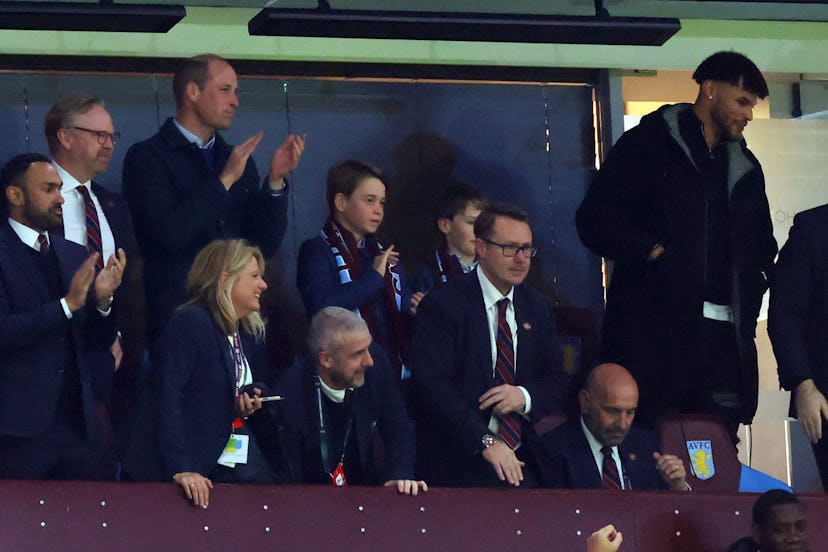 Prince William took Prince George to a football match.
