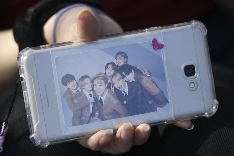 A fan of BTS showing off their phone, which they use to scroll on TikTok. 