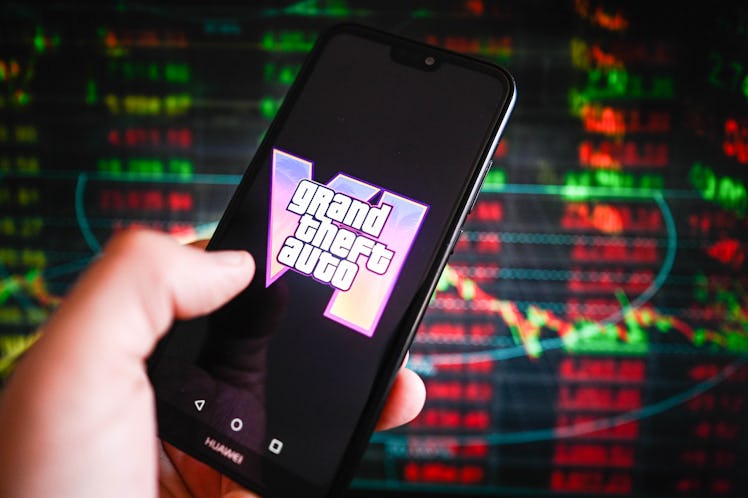 In this photo illustration, a Grand Theft Auto (GTA) VI logo is displayed on a smartphone with stock...