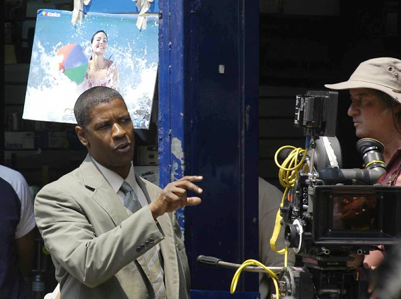 MEXICO CITY, MEXICO - APRIL 23:  Actor Denzel Washington (L) speaks with director Tony Scott during ...