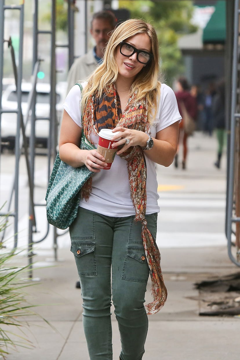 Hilary Duff carries a green Goyard Saint Louis on December 02, 2012 in Los Angeles, California. 