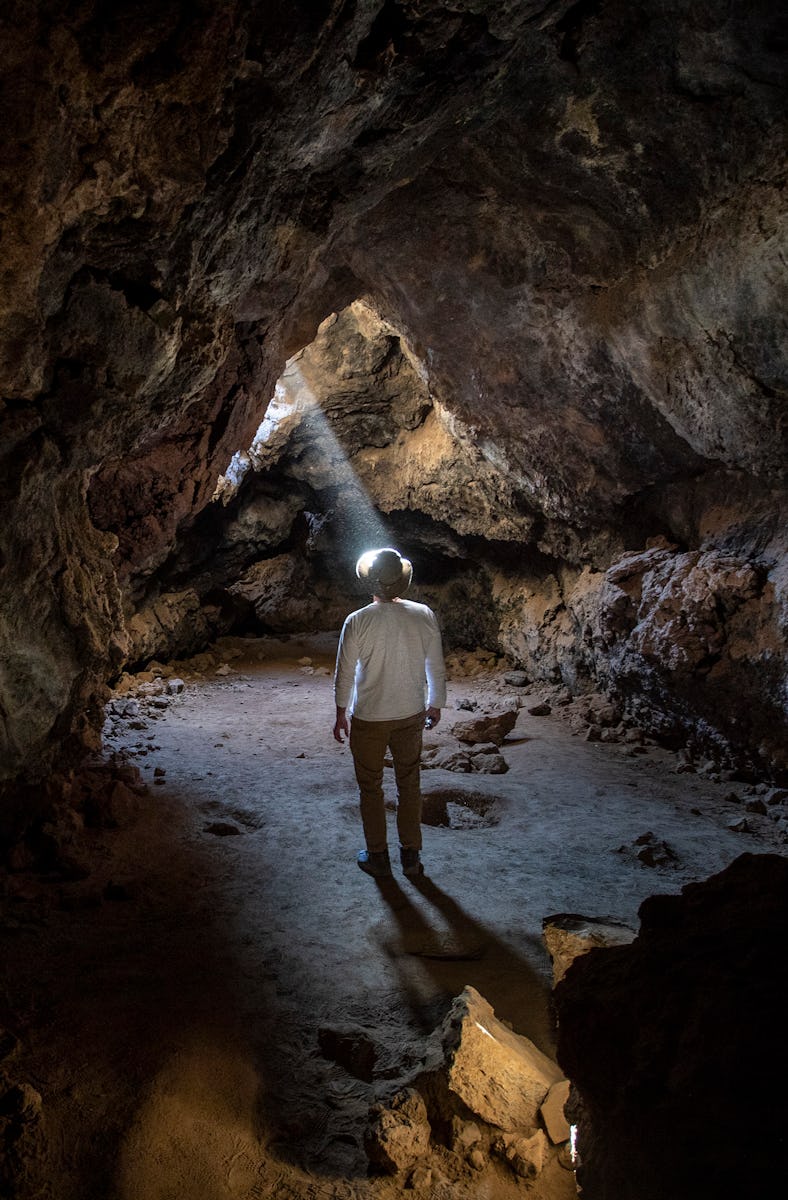 SAN BERNARDINO COUNTY, CA - APRIL 01: A shaft of light illuminates the Lava Tube, formed long ago by...