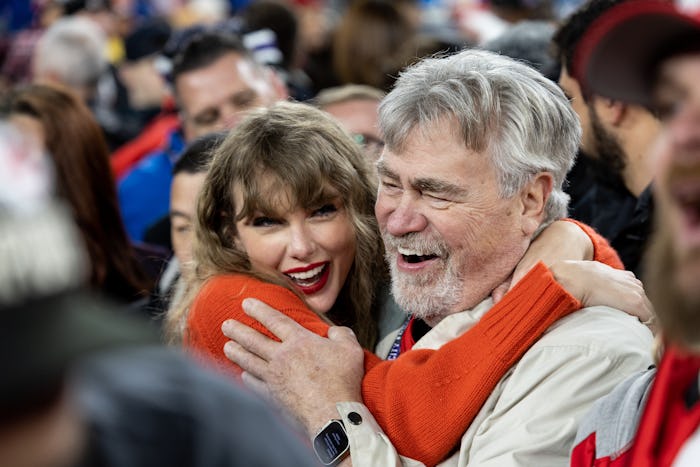 Taylor Swift hugs Ed Kelce after the AFC Championship game, in a story about how Taylor Swift shouts...