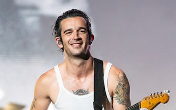 Matty Healy, who got a song on 'Tortured Poets,' performing onstage