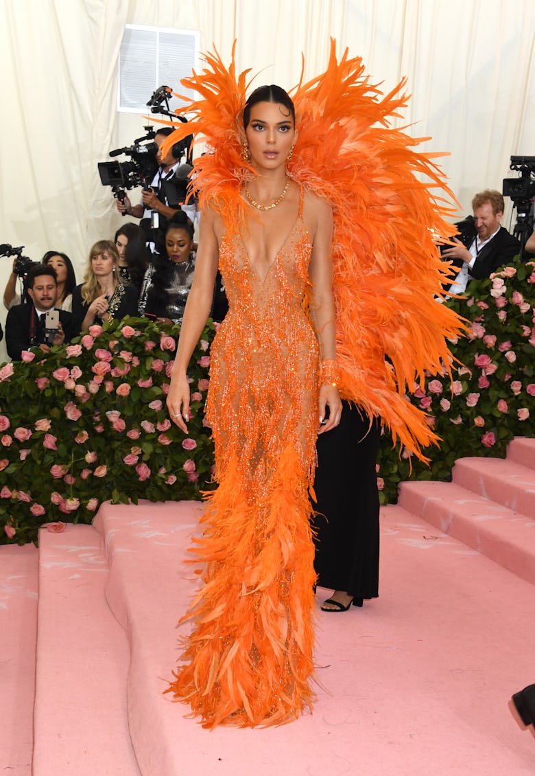 kendall jenner red dress met gala Kendall Jenner Put a Sexy Spin on Holiday Dressing in a Red Semi-Sheer Gown With No Bra