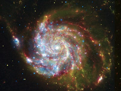 The spiral galaxy Messier 101, from composite of views from Spitzer, Hubble, and Chandra. (Photo by:...