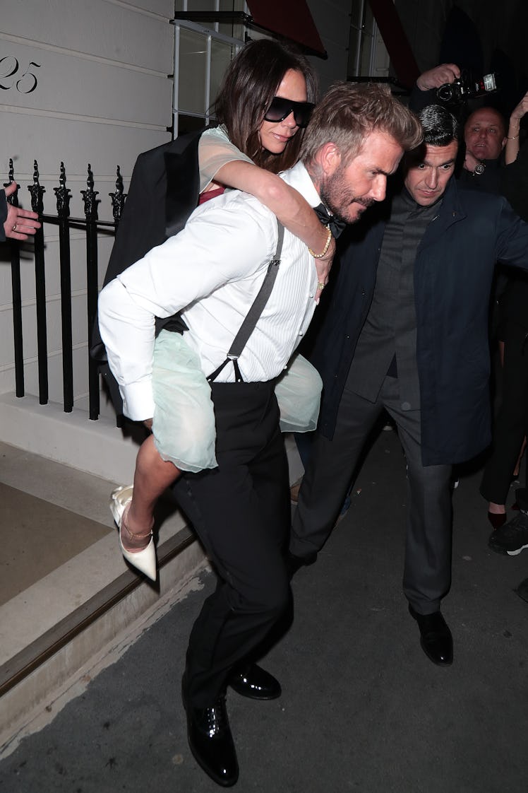 David Beckham and Victoria Beckham are seen leaving Victoria Beckham's 50th Birthday Party at Oswald...