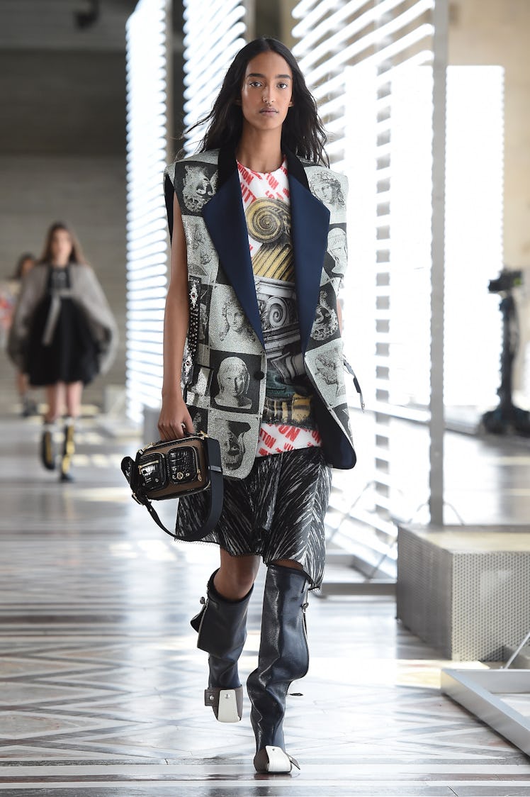 In this image posted on March 10, a model walks the runway at the Louis Vuitton fashion show...