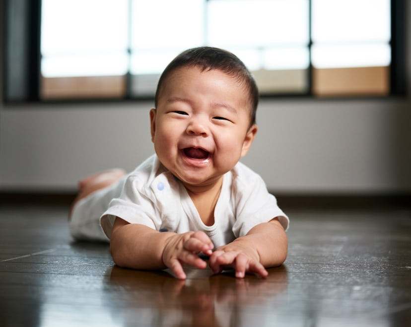 A six month old Japanese baby boy inside a home.