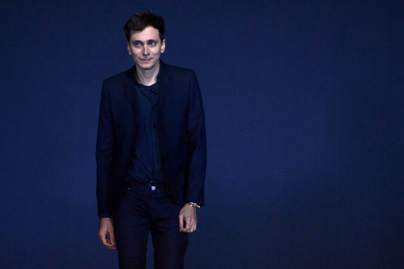 French-born designer Hedi Slimane for Saint Laurent acknowledges the public during the Spring/Summer...