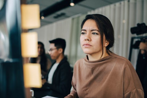woman looking confused while working