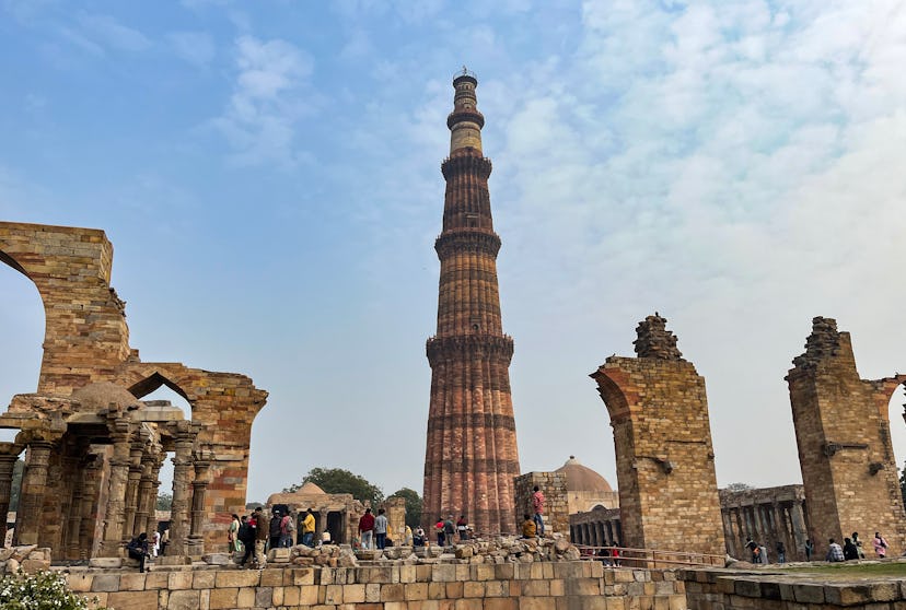 New Delhi, India. 23 January 2024. Tourists visit the Qutub Minar complex, on January 23, 2024 in Ne...