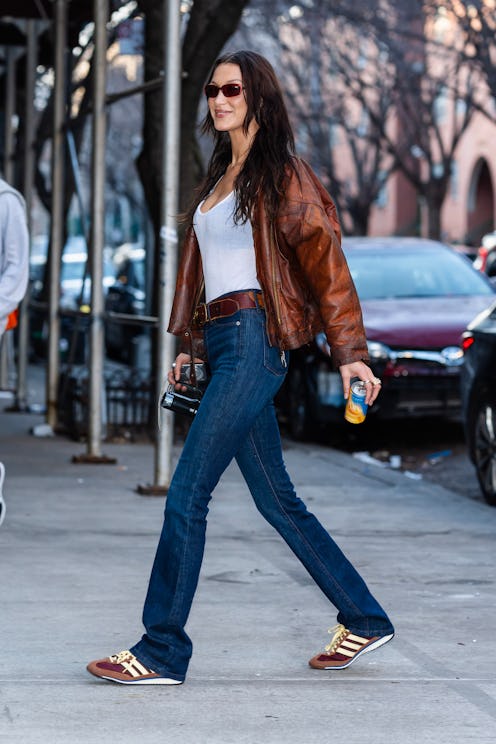 Bella Hadid visits the LES Girls Club wearing Adidas SL 72’s