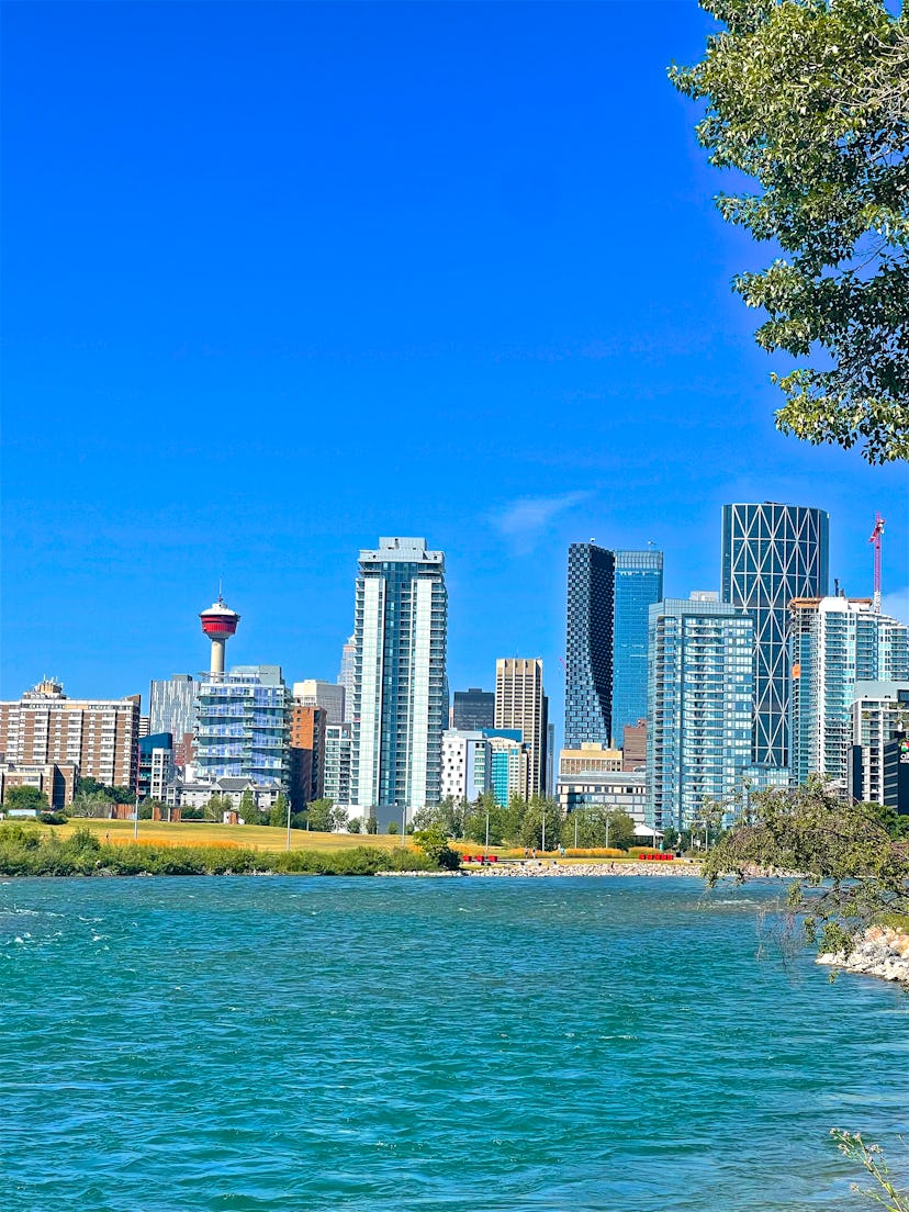The meeting of the Bow and Elbow Rivers, in front of the downtown area of Calgary, Alberta, Canada. ...